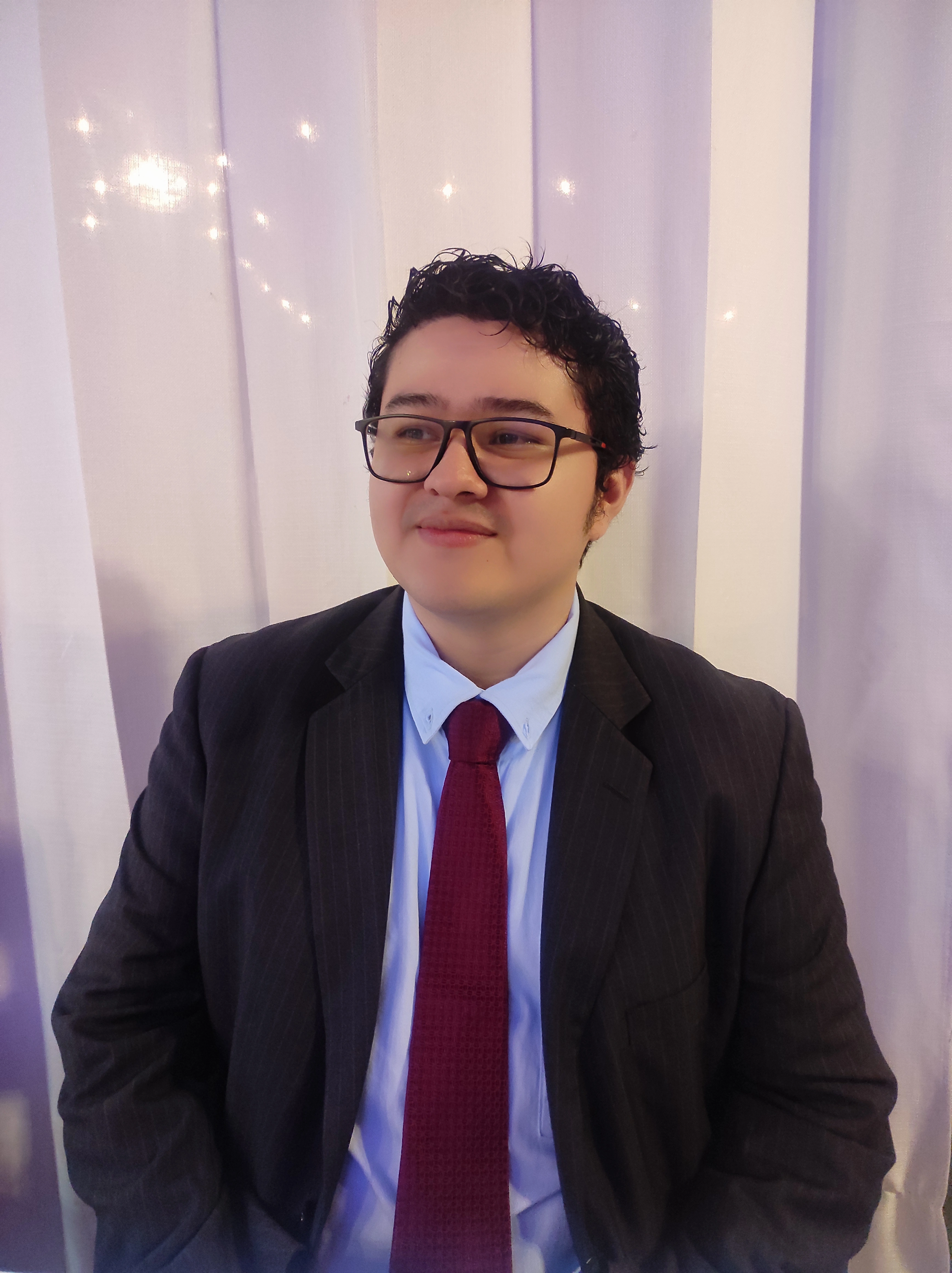 A handsome guy looking at the sky.